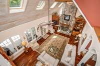 The loft at the top of the staircase gives stellar views of the living room.