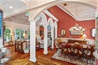 Cherry floors, arches, vaulted ceilings... the formal dining room is just inside the foyer.