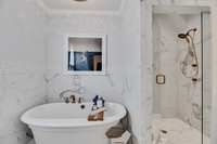 Primary en-suite with separate soaking tub and shower