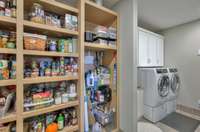 Large walk-in pantry with custom shelving.