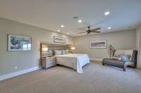 Oversized Primary Bedroom with custom headboard.