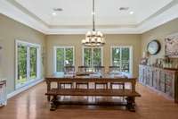 Huge eat in area adjacent to kitchen provides ample space for a large table and large gatherings. Tons of natural light!