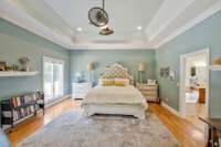 Master Bedroom with trey ceiling and gleaming hardwood floors