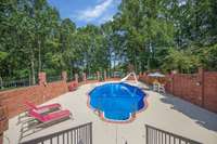 Newly installed Cool Decking around 10 foot deep saltwater pool with fully enclosed brick walls for privacy