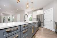 Quartz Island complete with custom Brass Hardware, Deep Single Bowl Kitchen Sink with luxury embellished faucet with dual function spray head nozzle.