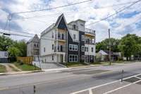 Exterior Photo. Shows shared driveway that leads to each unit's 2 Car Garages. Also includes 4 additional parking pads one surface space per Unit ideal for Guests.