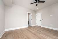 View of Primary Bedroom into Ensuite Bathroom.
