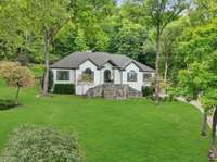 Set on a picturesque one acre wooded lot, this home offers views and breathtaking scenery out every window:)