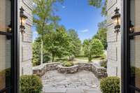 The flagstone patio in front provides an elegant entrance to the home.