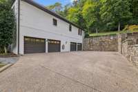 The HUGE four car garage is truly a car collectors dream!  The extra deep bays can accomodate additional cars and the space also has a large storage closet and additional storage nooks.