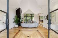 What a gorgeous foyer!  Note the custom inset design on the hardwood floor.  There are hardwood floors thoughout this home - all in excellent condition!