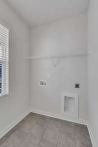 Main level laundry room, tucked away from the main living areas.