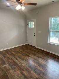 living room area with laminate flooring throughout