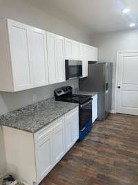 kitchen with granite countertops and stainless appliances