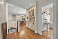 The built-in butler's pantry leads to the kitchen and family room.