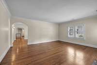 The formal living room has original wood floors.