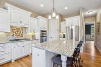 The Kitchen is the heart of the home! Note the freshly painted cabinetry.