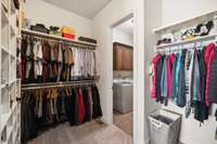 Two walk-in closets complete this space, both feature built-in shelving while the larger of the two has access to the Laundry Room.