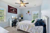 Located on the Upper Level, Bedroom #3 includes plush carpet, ceiling fan, and walk-in closet with built-in shelving.