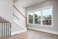 Stairs leading to the 3rd Level where 2 additional Bedrooms, Primary and Guest are located.