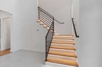 Illuminated stair treads leading to the office and 2nd floor