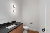 One of two main floor half baths - mirror to be selected by buyer