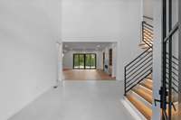 The foyer draws you into the heart of the home with views straight through to the back yard.