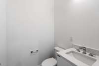 The second main floor powder room, this one is located just off the back patio for easy access.