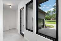 Friends door with access to the garage and pantry corridor
