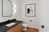 Main floor powder room 1 of 2 with digital staging