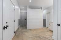 Walk Through Shower in Basement. Privacy Shiplap wall. Spaced designed for direct entry from future pool/hot tub.