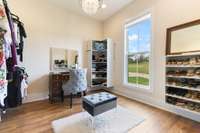 Bring all the shoes and the clothes!  This California Closet Dressing room in your Primary Suite is spacious and just what you need! Your Private Dressing Room is complete with a Crystal Chandelier.