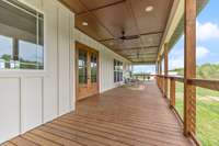 63 x 12 Back deck overlooks your private pond/acreage and butterfly meadows.  The ceiling is Hardboard. Gas line installed for entertaining and 3 ceiling fans for those warm summer days.