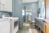 Laundry facility in bathroom. Washer and Dryer Remain!  Custom Slate walk-in Shower. Double Vanities.