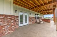 Beautiful Stamped Concrete covered patio. 6 person hot tub can remain! Exterior gas lines are installed on patio for outdoor barbeque or kitchen.