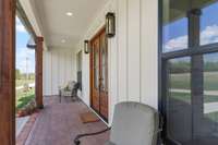 Stamped Concrete porch adorned with Gas Lanterns! Ahh Morning coffee never tasted so good.