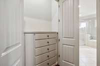 A secondary closet offers additional storage options.