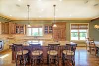 Huge kitchen with breakfast bar seating and storage.