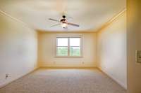 Upstairs guest bedroom off of common area, has its own bath as well. A blank canvas for your decor.