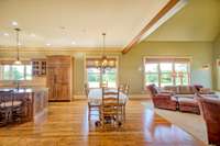 Dining area between kitchen and gathering room is perfect for casual dining with family and friends.