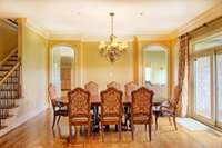 Spacious dining room located between the living room and kitchen.