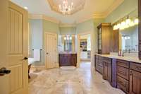 Luxurious primary bathroom with double vanities.