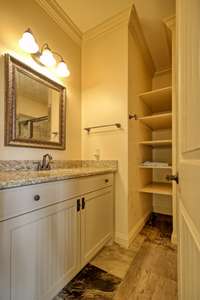 Upstairs bathroom with extra shelving.