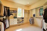 Primary bedroom closet offers plenty of space for clothes, shoes and bag, even a jewelry island if you prefer.