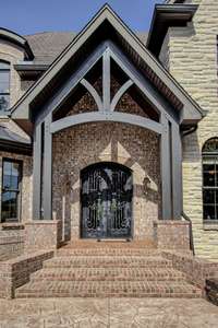 Exquisite double iron doors make for a grand welcome and entrance.