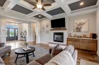 LIVING ROOM WITH ACCESS TO COVERED PORCH, COUFFERED CEILING, FIREPLACE