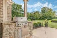 Outdoor grilling station.  Gas grill to remain with the home.