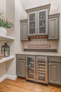 This Butler's Pantry bar area is conveniently tucked in the hallway between the Kitchen & Formal Dining Room area.