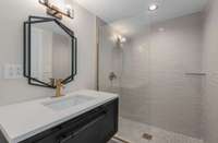 The floating vanity and tiled shower provide a beautiful space for your guests.