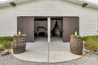 Entrance to Wedding Venue, adorned with chandeliers, beautiful barn wood accents